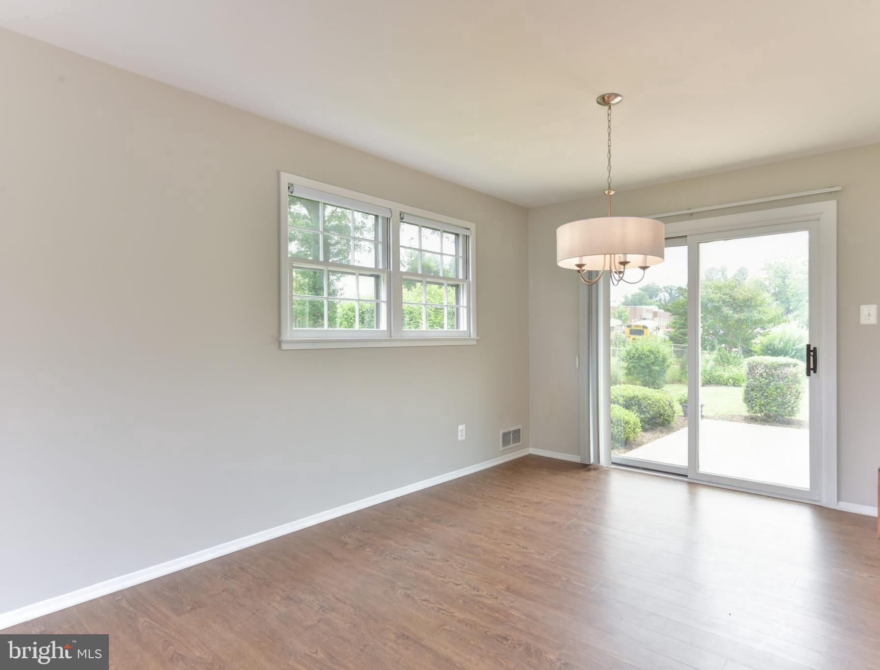 8021 Ellet Road Springfield, VA 22151 - Photo 9 of 53 an empty room with wooden floor and windows
