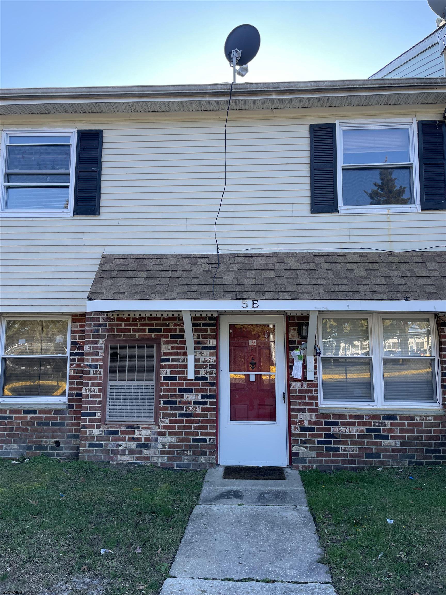 720 South New Road, Unit 5E Absecon, NJ 08201 - Photo 3 of 8 a front view of a house with garden
