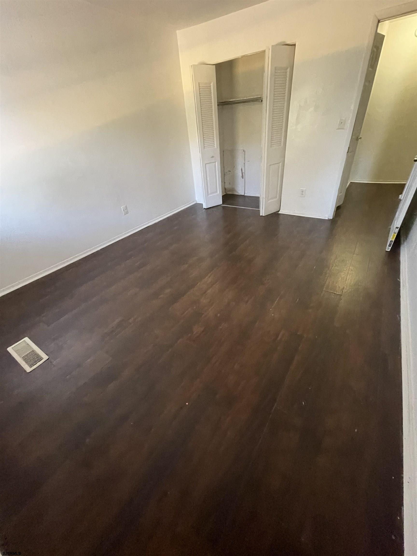 720 South New Road, Unit 5E Absecon, NJ 08201 - Photo 7 of 8 a view of empty room with wooden floor
