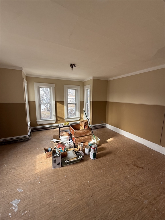 74 Bacon Street, Unit 2 Orange, MA 01364 - Photo 2 of 6 a living room with furniture and a window