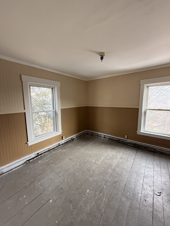 74 Bacon Street, Unit 2 Orange, MA 01364 - Photo 4 of 6 an empty room with a window