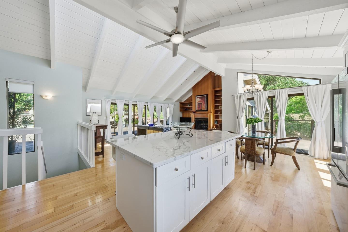 701 Day Valley Road Aptos, CA 95003 - Photo 9 of 43 a large kitchen with kitchen island a large counter space a sink appliances and a dining table
