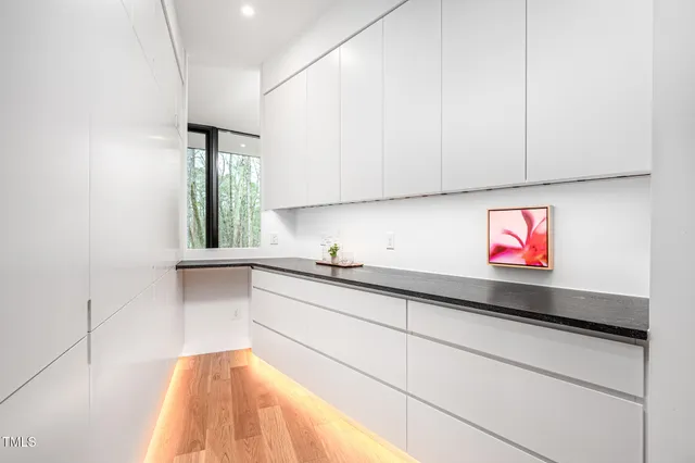 a open kitchen with kitchen island a refrigerator stove top oven and sink
