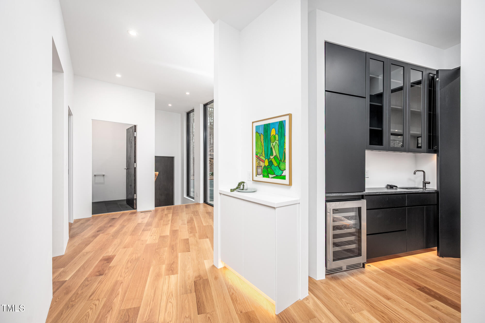 721 Jones Ferry Road Chapel Hill, NC 27516 - Photo 13 of 43 a open kitchen with kitchen island a refrigerator stove top oven and sink