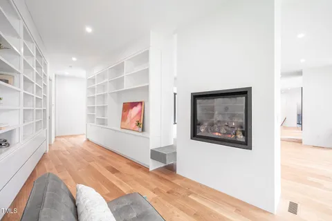 a bedroom with a large bed and a large window