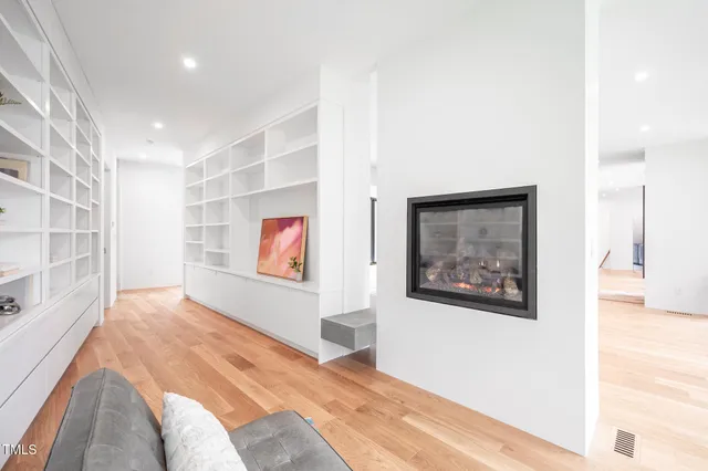 a bedroom with a large bed and a large window