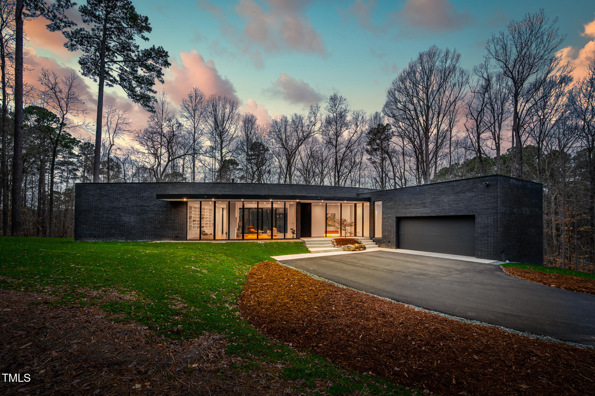 721 Jones Ferry Road Chapel Hill, NC 27516 - Photo 2 of 43 a front view of a house with garden