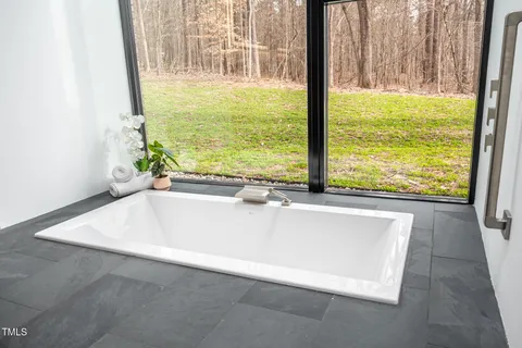 a view of a bathroom with a shower and a sink