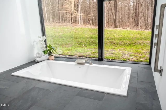 a view of a bathroom with a shower and a sink