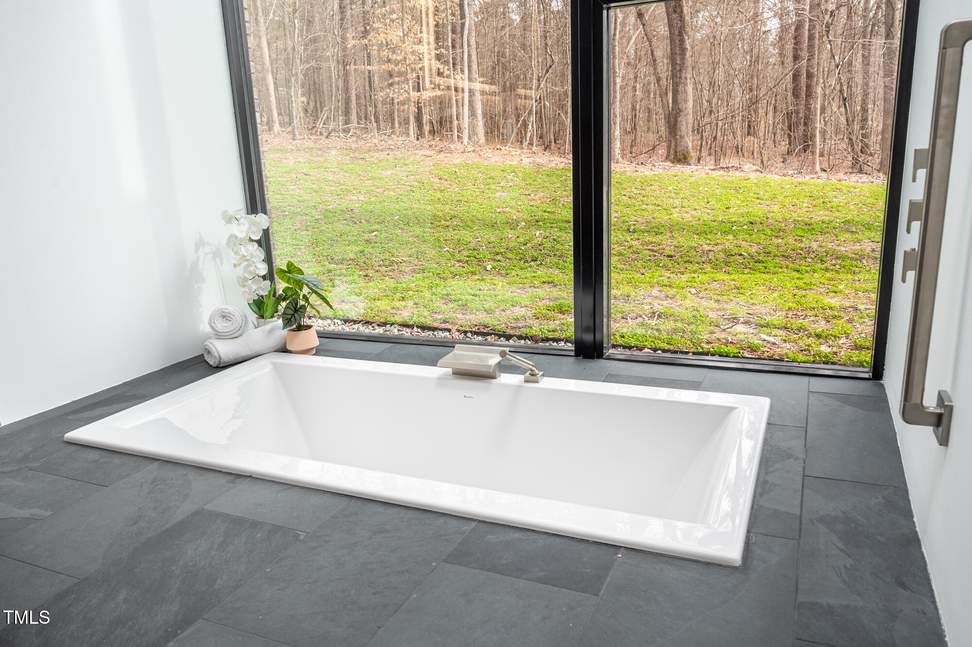 721 Jones Ferry Road Chapel Hill, NC 27516 - Photo 21 of 43 a bath tub sitting in front of a window