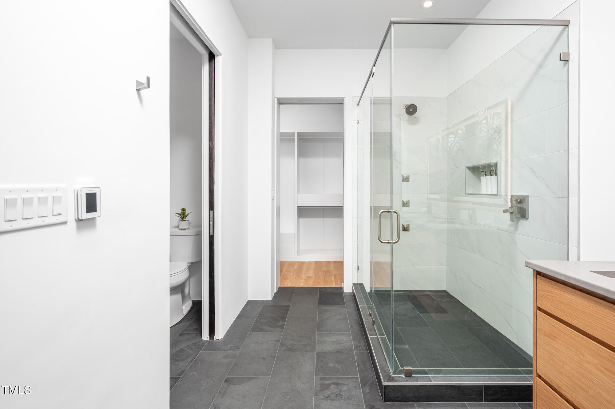 721 Jones Ferry Road Chapel Hill, NC 27516 - Photo 22 of 43 a view of a bathroom with a shower and a sink