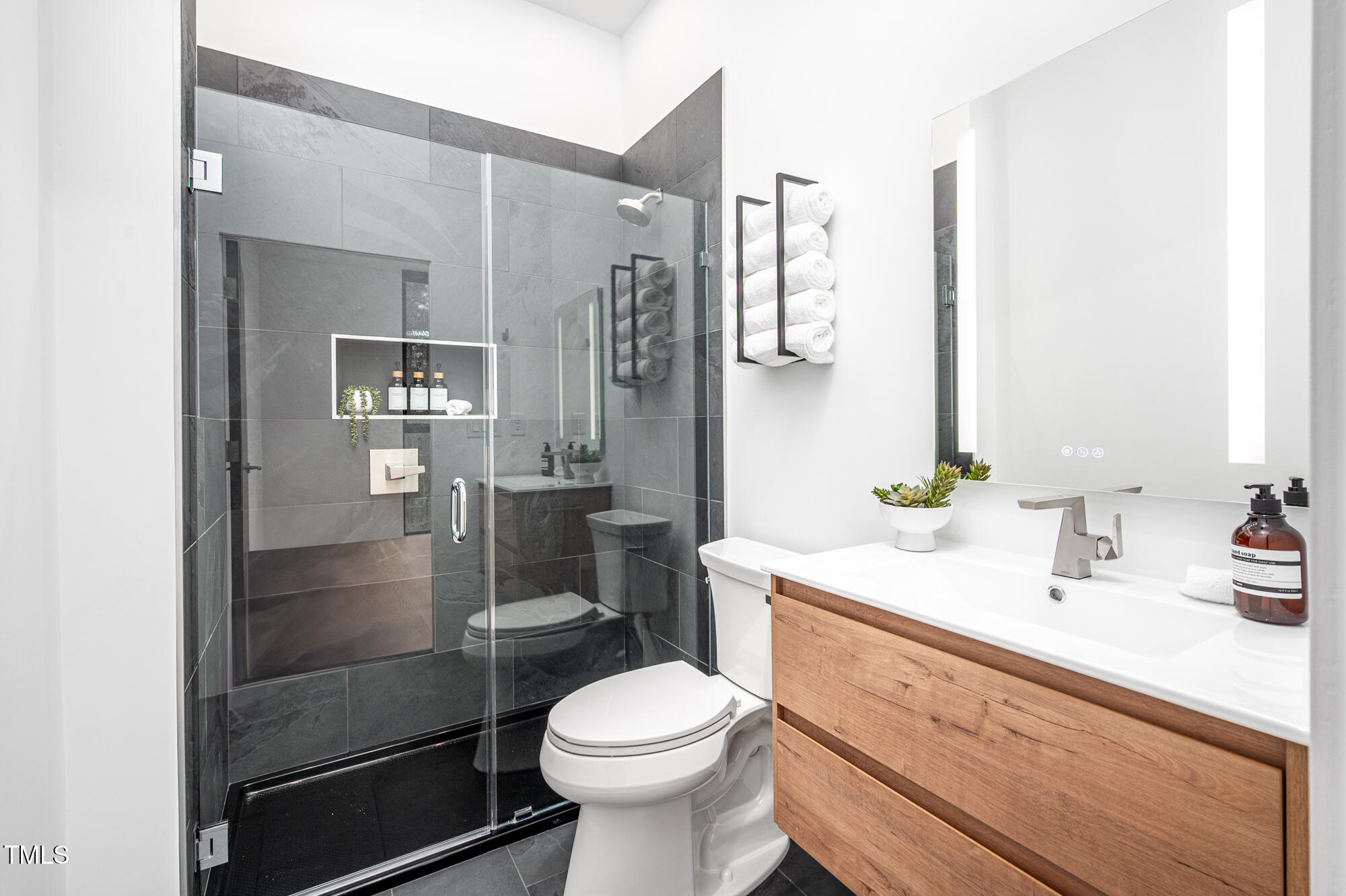 721 Jones Ferry Road Chapel Hill, NC 27516 - Photo 29 of 43 a bathroom with a sink toilet and shower