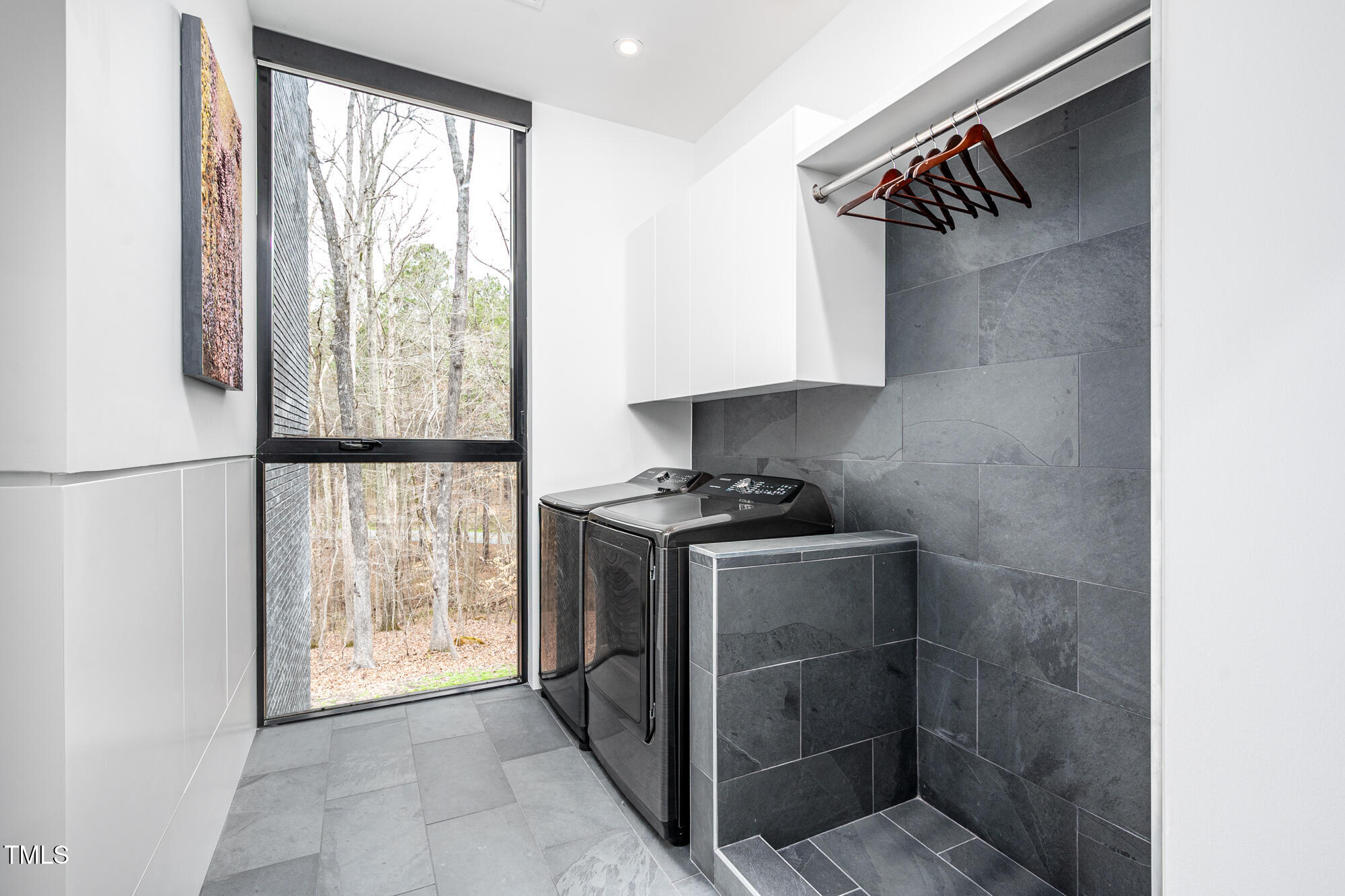 721 Jones Ferry Road Chapel Hill, NC 27516 - Photo 34 of 43 a view of storage and utility room with washer and dryer