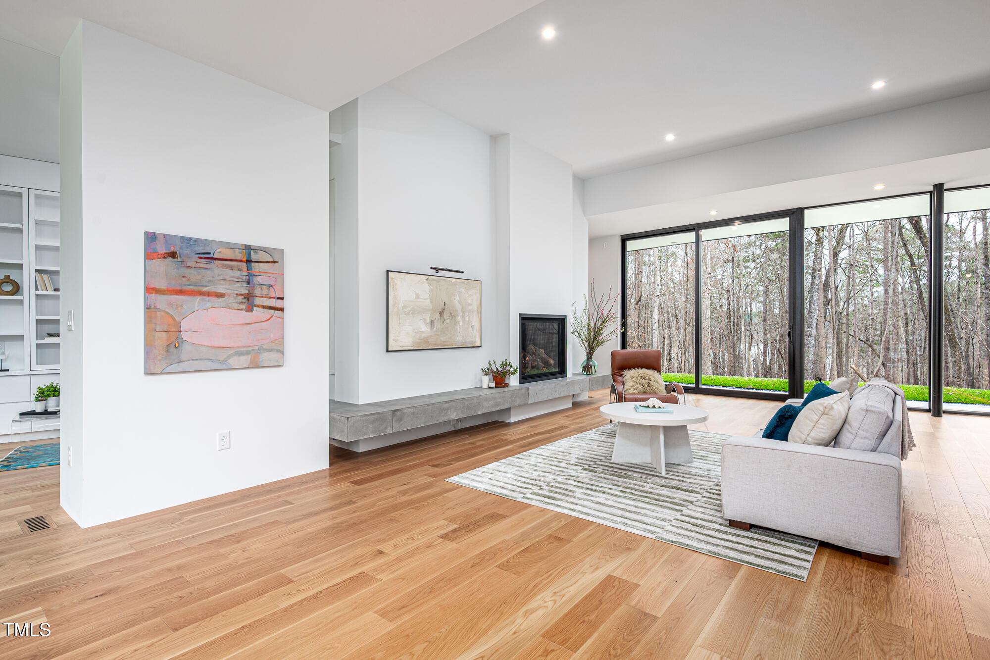 721 Jones Ferry Road Chapel Hill, NC 27516 - Photo 4 of 43 a living room with furniture and a large window