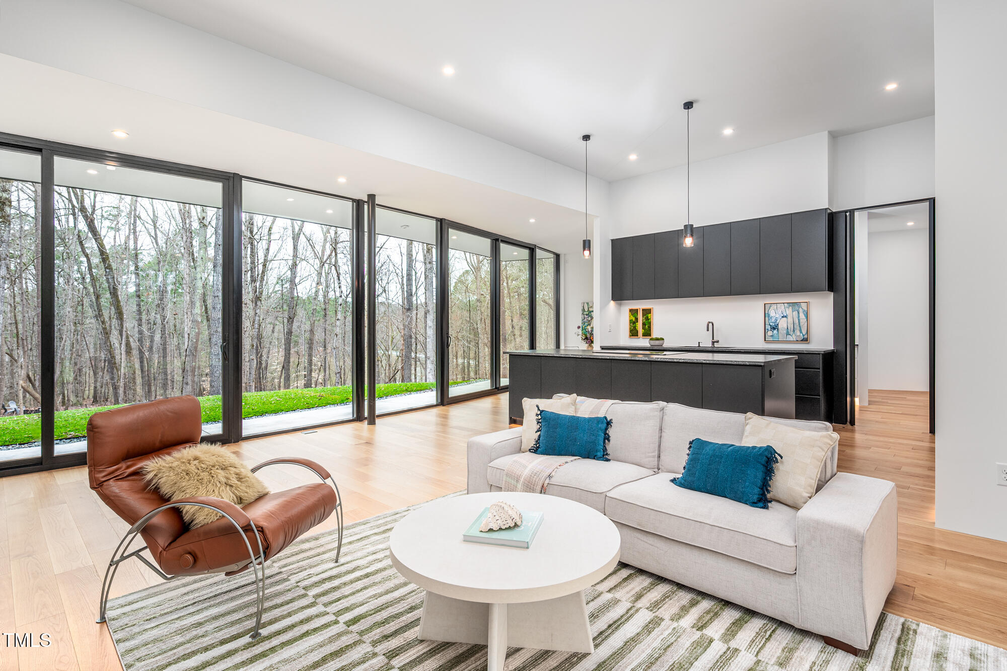 721 Jones Ferry Road Chapel Hill, NC 27516 - Photo 6 of 43 a living room with furniture and a large window