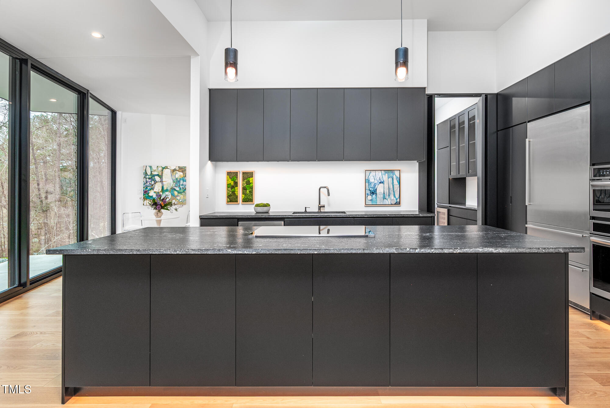 721 Jones Ferry Road Chapel Hill, NC 27516 - Photo 7 of 43 a kitchen with a sink a counter space appliances and cabinets