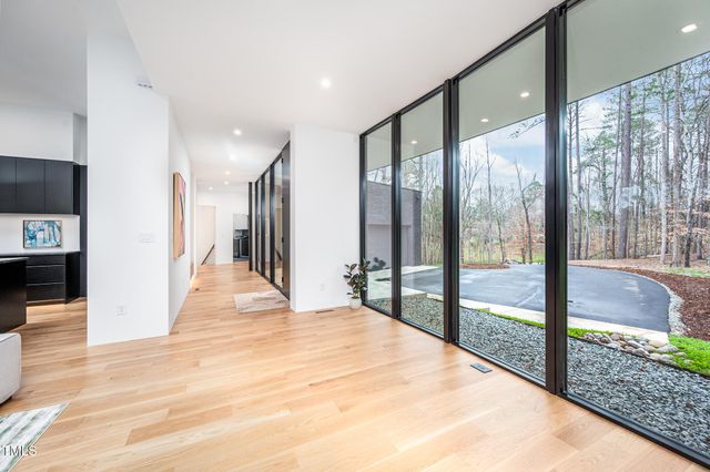 a kitchen with granite countertop white cabinets and stainless steel appliances