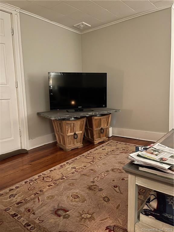 25 South End Road, Unit 2 East Haven, CT 06512 - Photo 16 of 18 a view of a livingroom with wooden floor and a flat screen tv