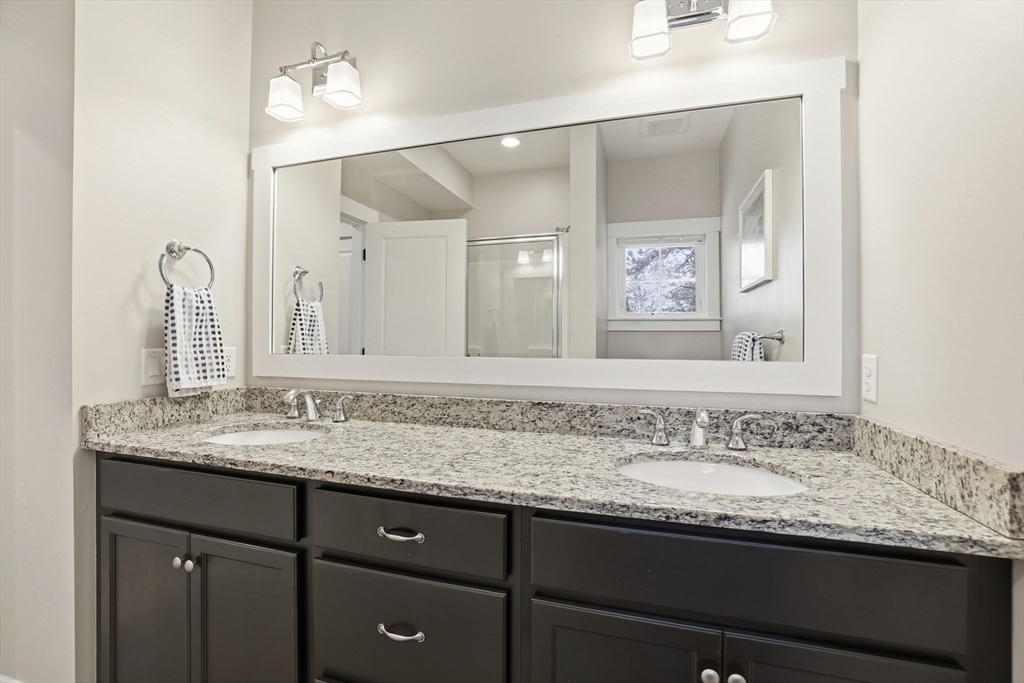 17 Inkberry Lane Plymouth, MA 02360 - Photo 12 of 30 a bathroom with a granite countertop sink two large mirror and a