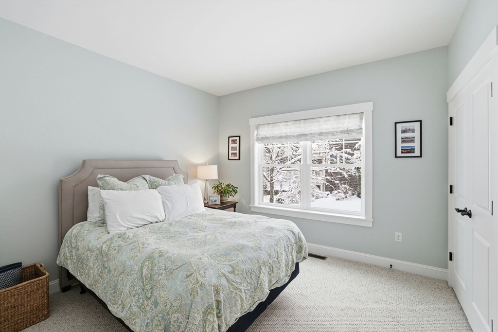 17 Inkberry Lane Plymouth, MA 02360 - Photo 14 of 30 a large bed sitting in a bedroom next to a window