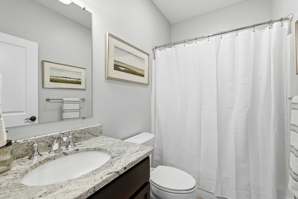 17 Inkberry Lane Plymouth, MA 02360 - Photo 17 of 30 a bathroom with a granite countertop sink toilet and a mirror