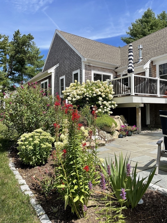 17 Inkberry Lane Plymouth, MA 02360 - Photo 21 of 30 a front view of a house with a lot of flower plants