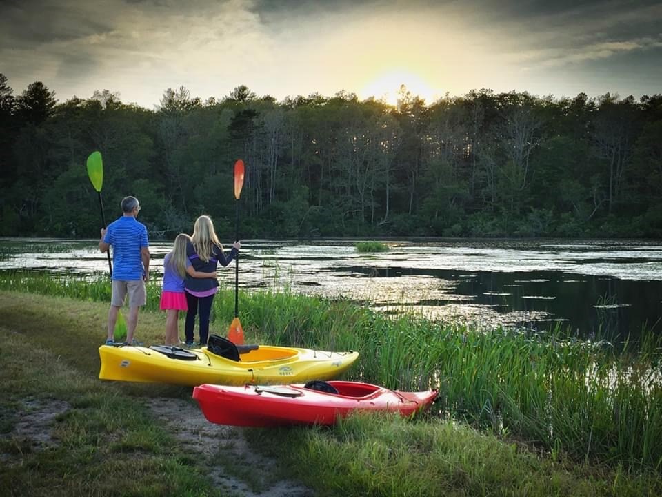 17 Inkberry Lane Plymouth, MA 02360 - Photo 29 of 30 a view of a lake with a table and chairs