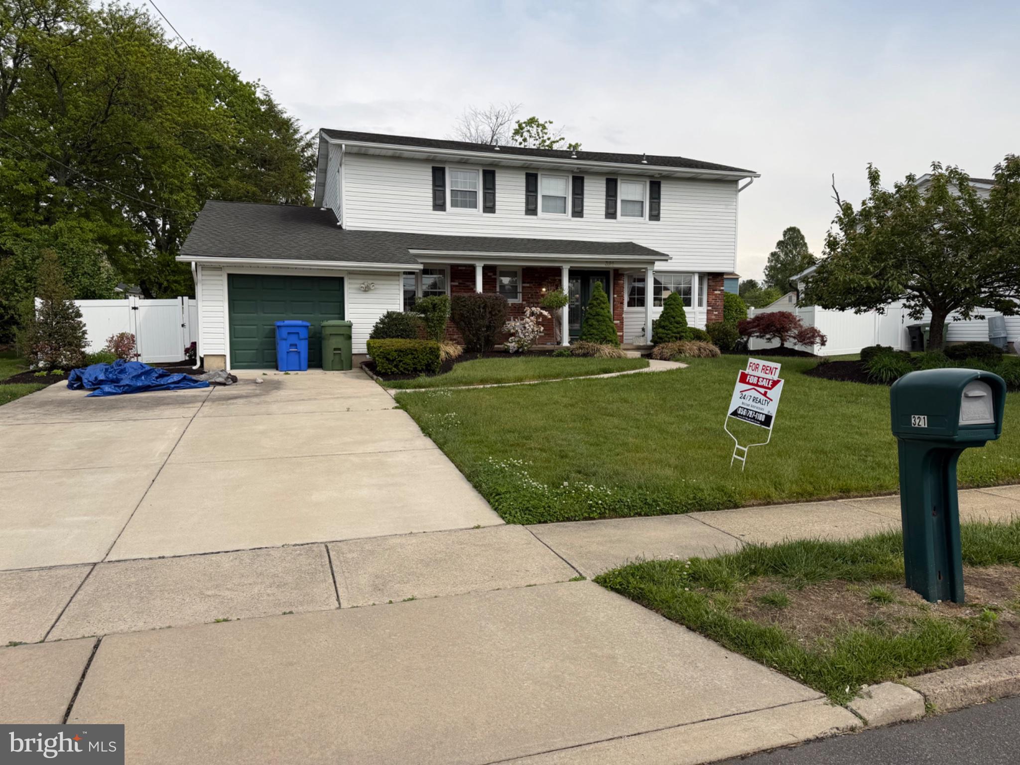 321 Surrey Road Cherry Hill, NJ 08002 - Photo 2 of 24 a front view of a house with a yard