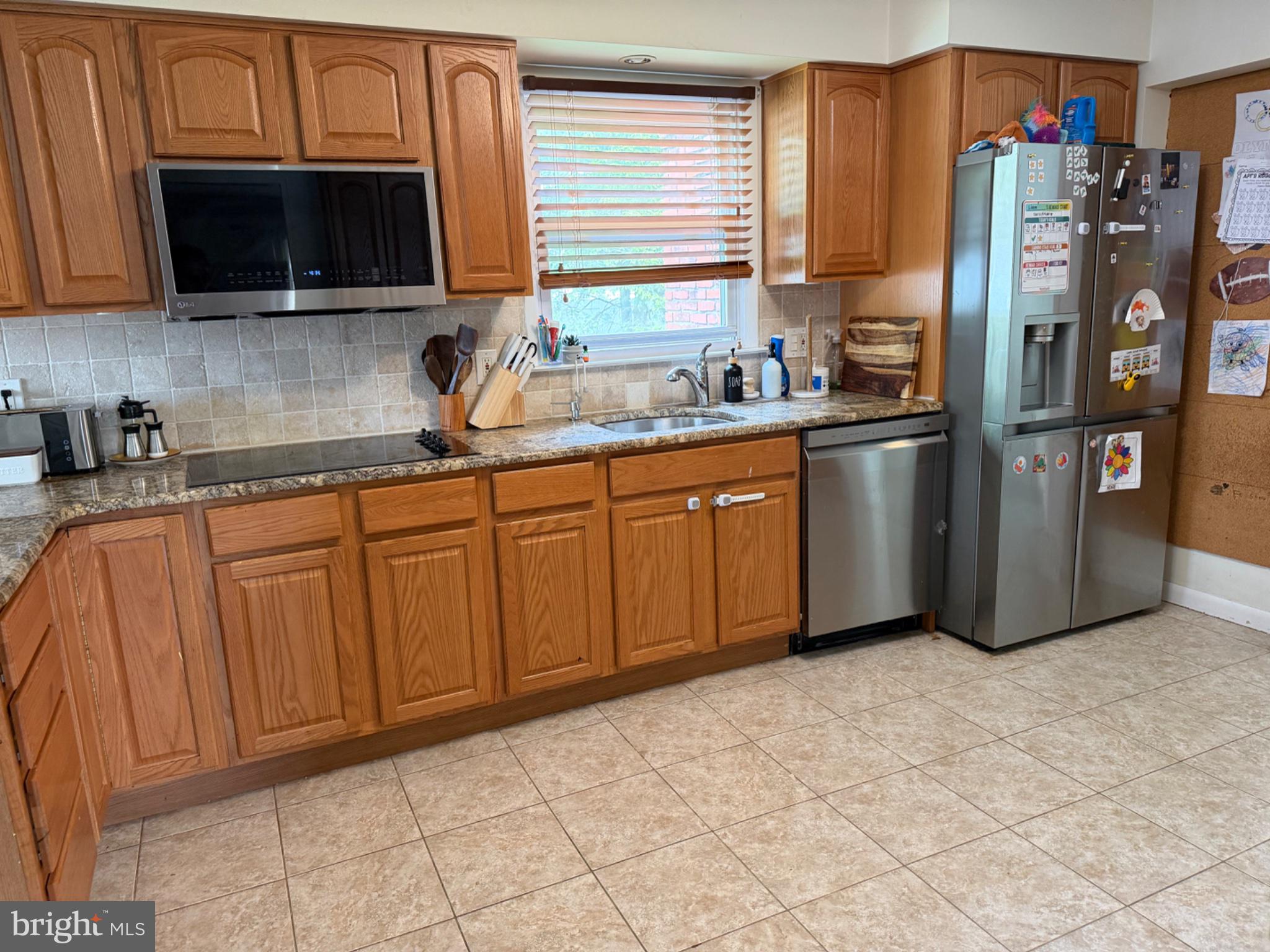 321 Surrey Road Cherry Hill, NJ 08002 - Photo 3 of 24 a kitchen with stainless steel appliances granite countertop a refrigerator and a sink