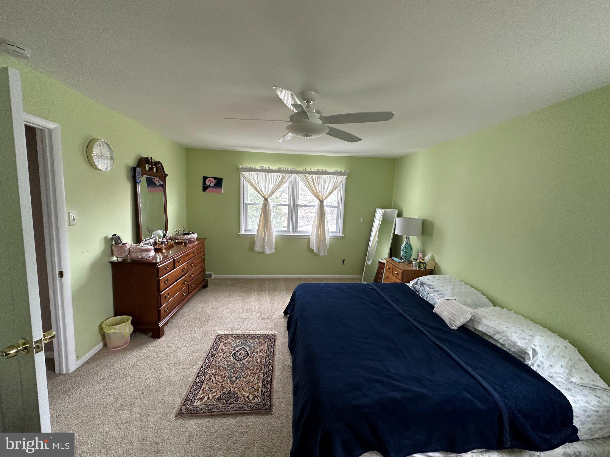321 Surrey Road Cherry Hill, NJ 08002 - Photo 9 of 24 a bed room with a bed and a mirror
