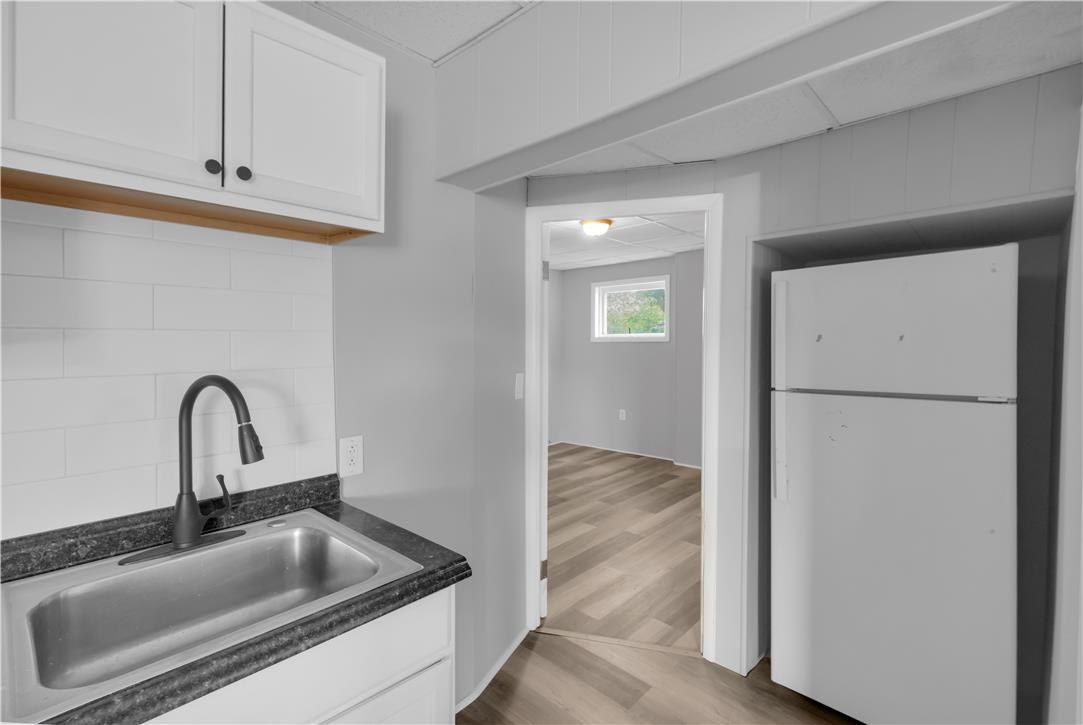 149 West Ridge Street, Unit 2A Lansford, PA 18232 - Photo 14 of 14 Crisp white cabinetry paired with durable countertops highlights this functional space.