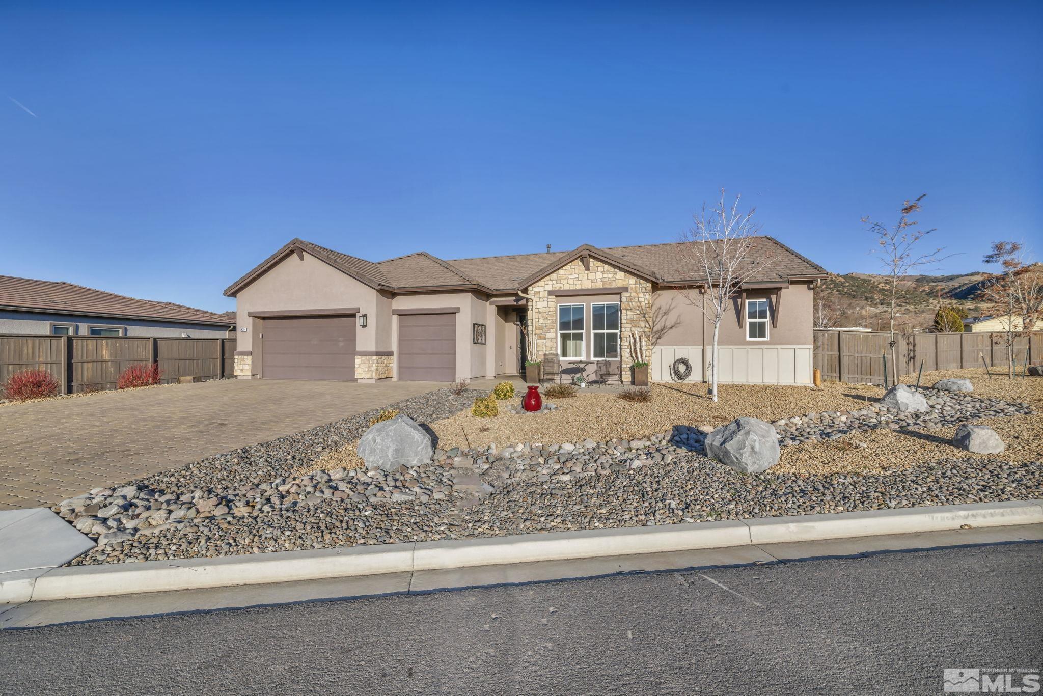14264 Silver Moon Court Reno, NV 89521 - Photo 1 of 39 a front view of a house with a yard