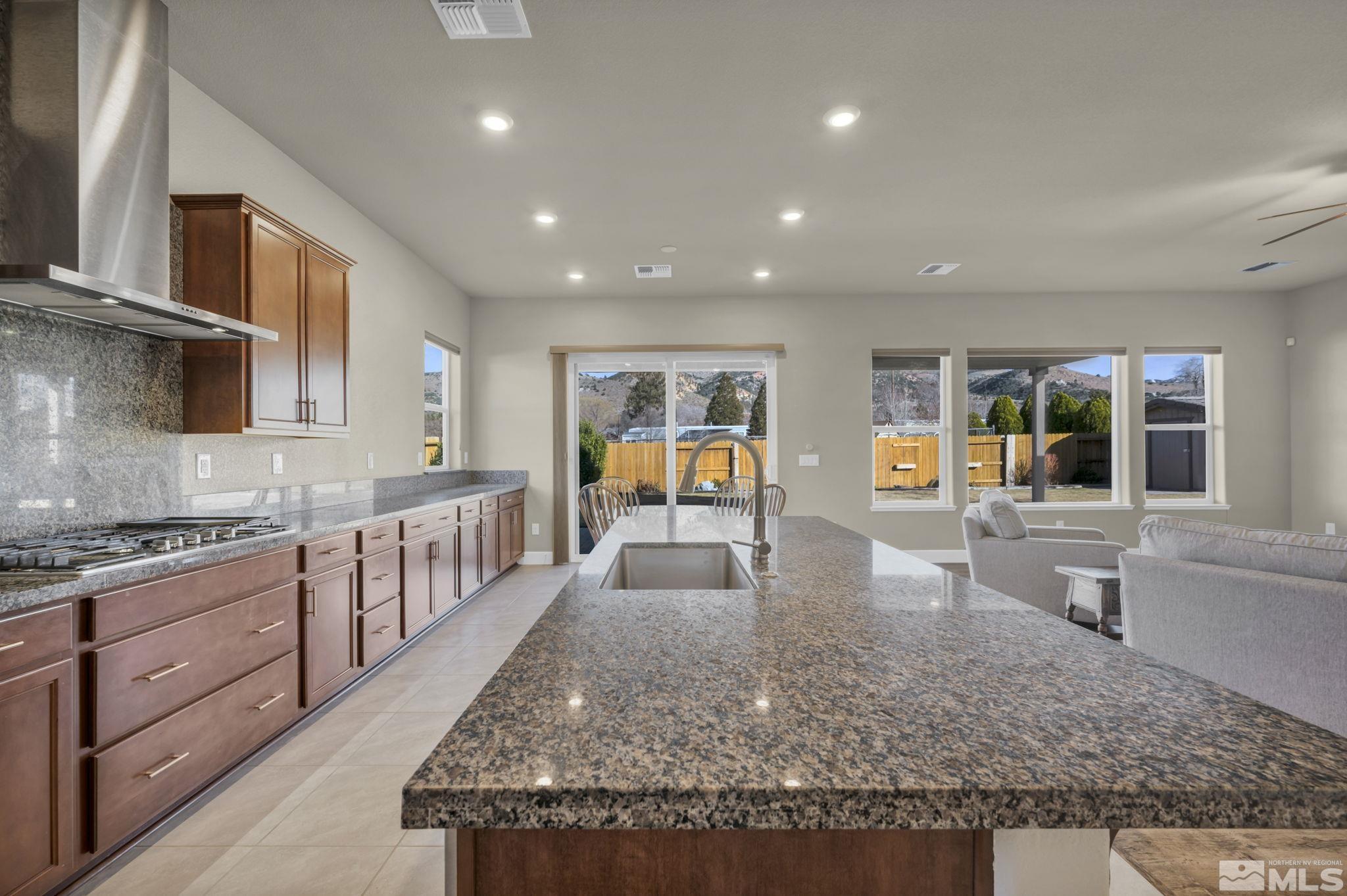 14264 Silver Moon Court Reno, NV 89521 - Photo 13 of 39 a large kitchen with granite countertop lots of counter top space