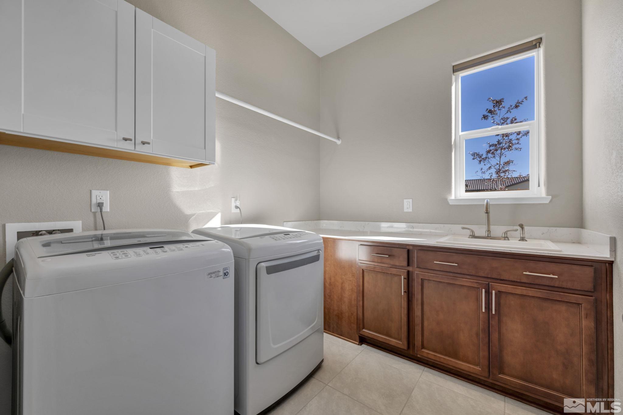14264 Silver Moon Court Reno, NV 89521 - Photo 15 of 39 a utility room with sink dryer and washer