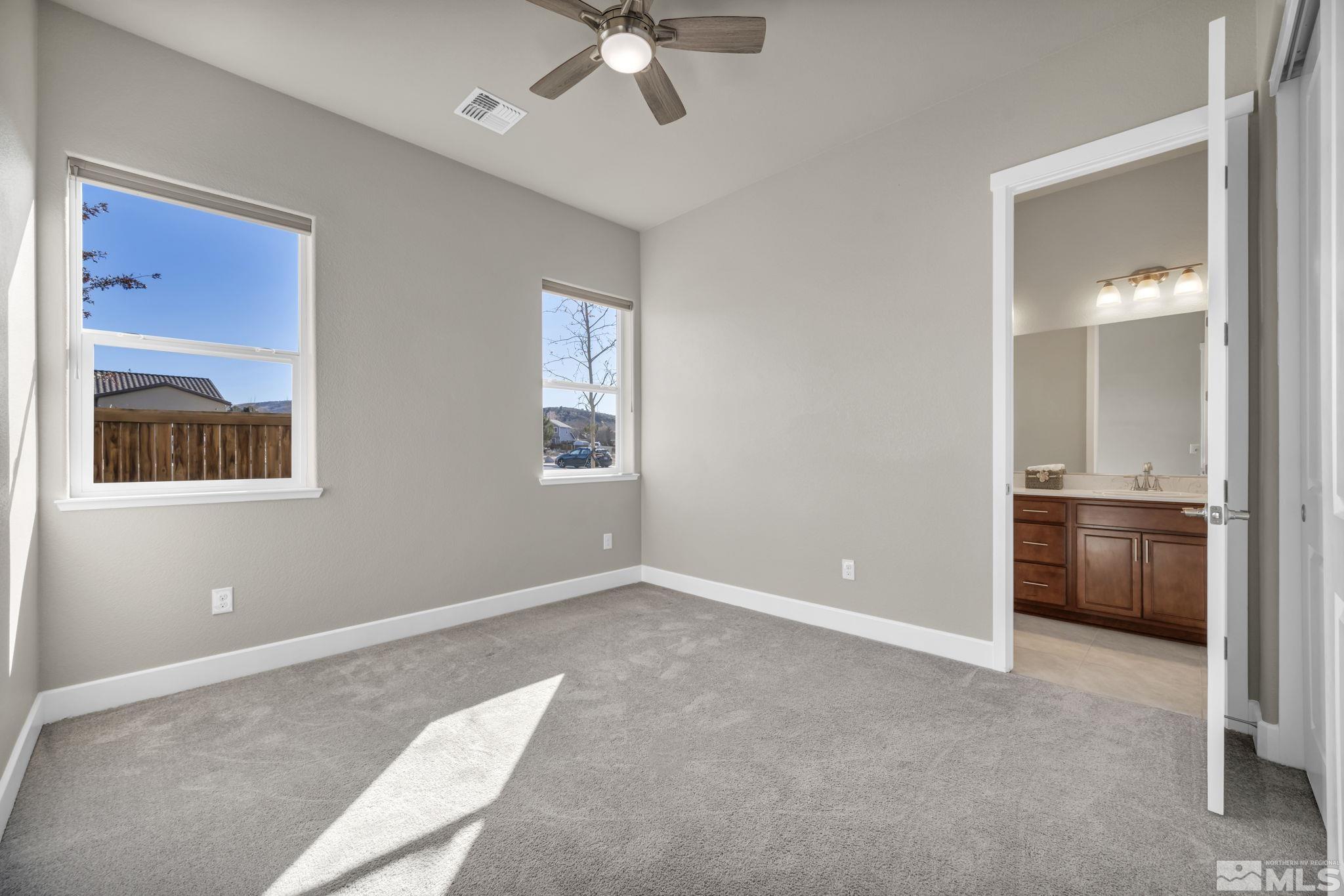 14264 Silver Moon Court Reno, NV 89521 - Photo 21 of 39 a view of an empty room with a window