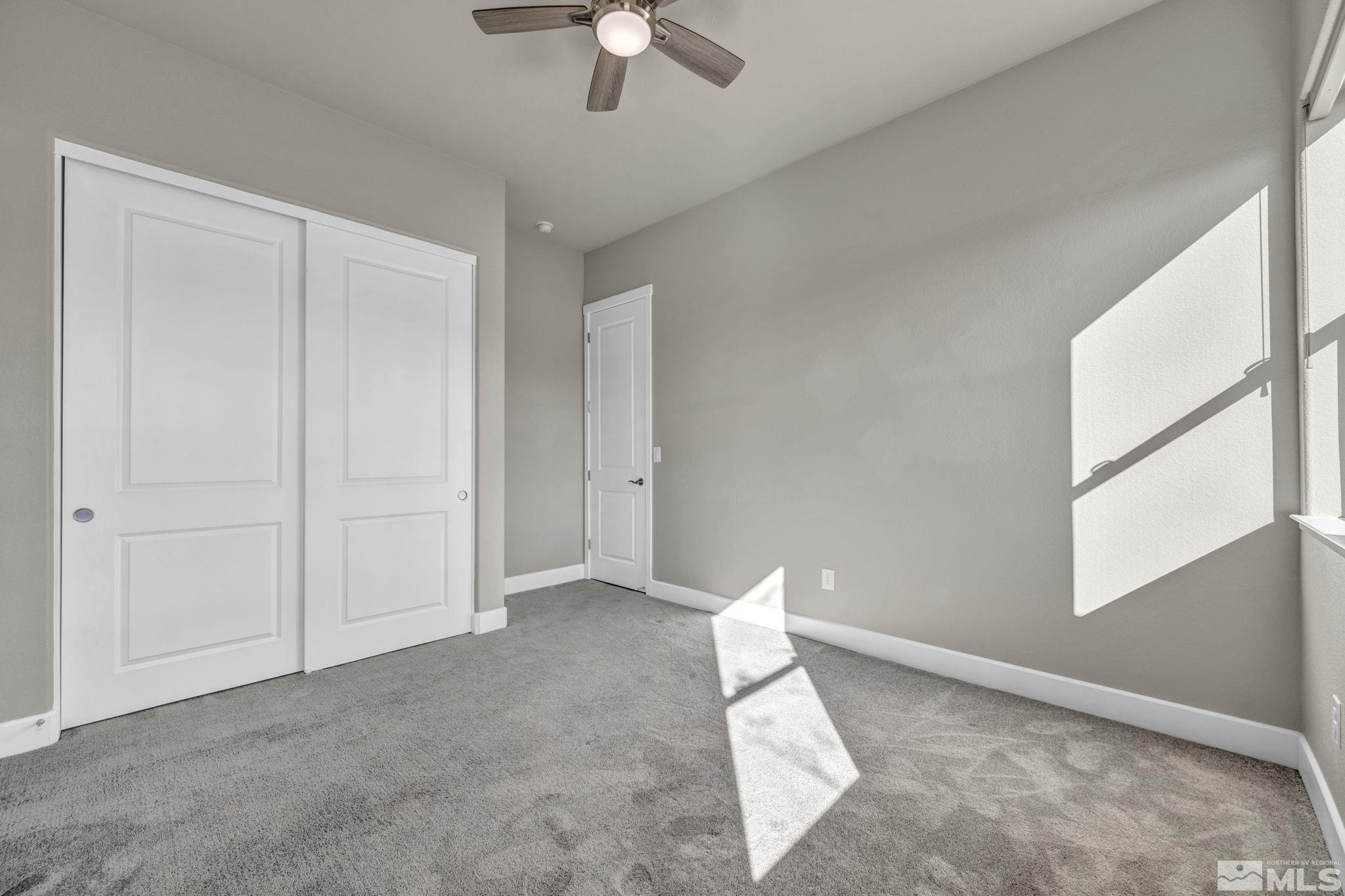 14264 Silver Moon Court Reno, NV 89521 - Photo 23 of 39 a view of a livingroom with an empty space and a window