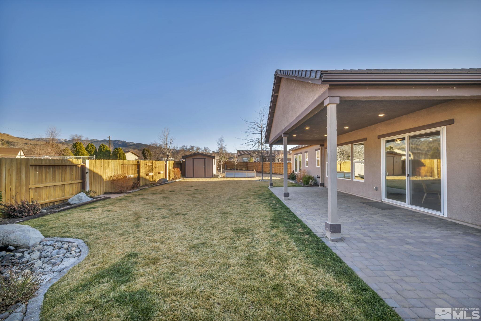 14264 Silver Moon Court Reno, NV 89521 - Photo 29 of 39 a view of a house with a yard