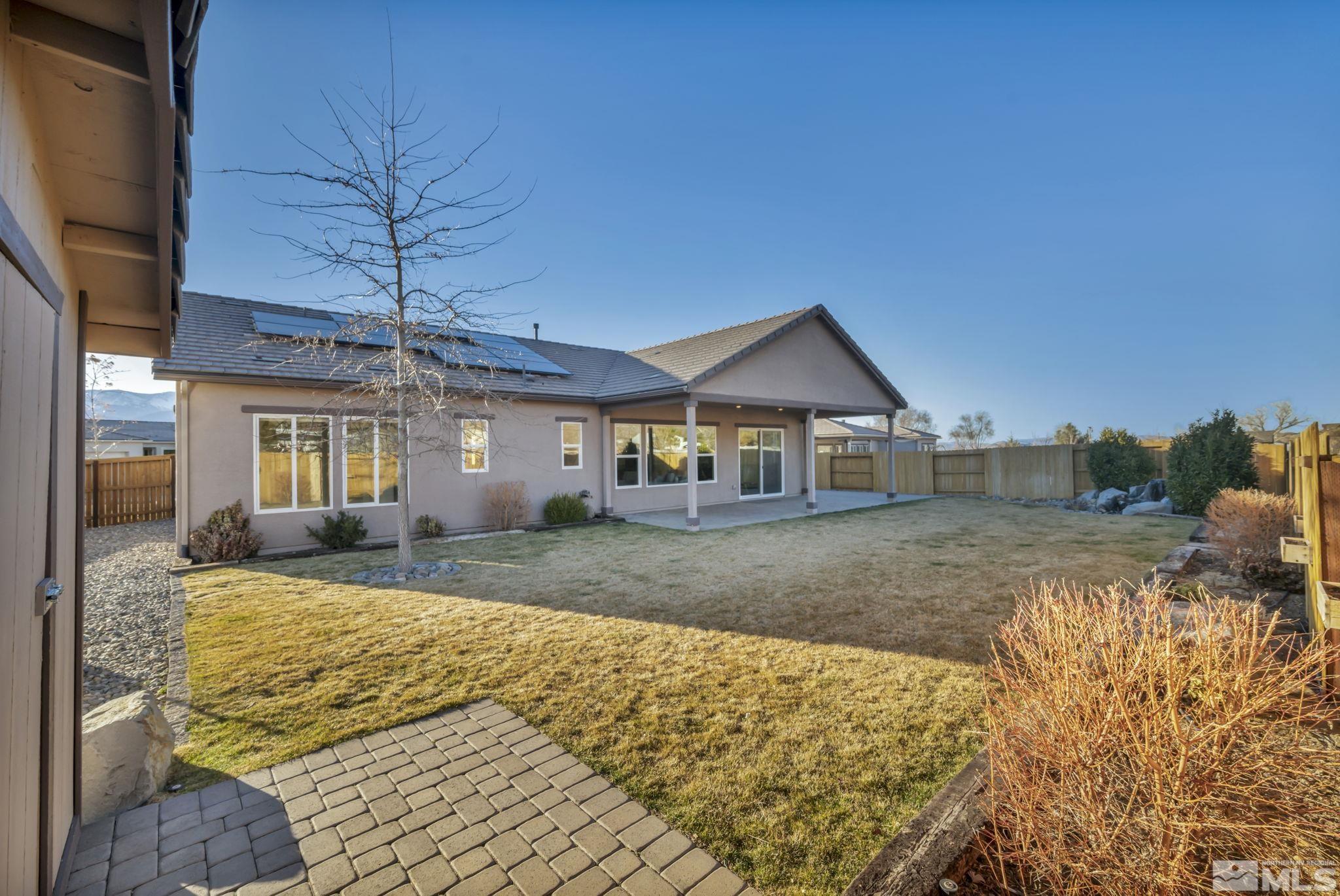 14264 Silver Moon Court Reno, NV 89521 - Photo 30 of 39 a view of a house with a yard