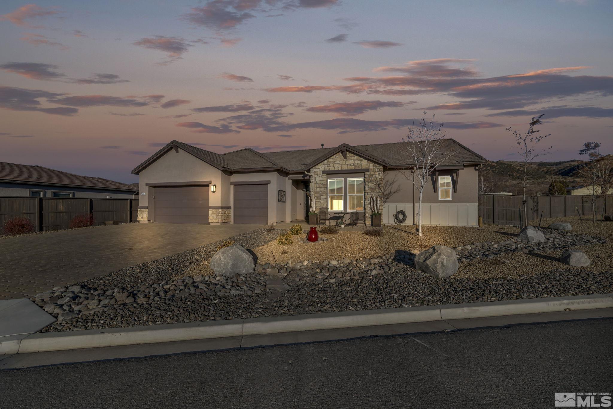 14264 Silver Moon Court Reno, NV 89521 - Photo 3 of 39 a front view of a house with a yard