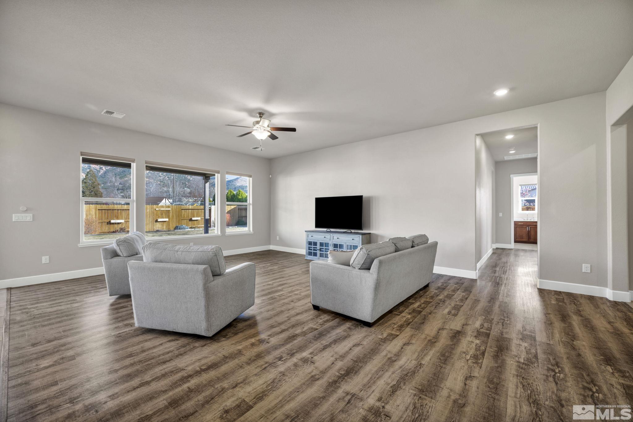 14264 Silver Moon Court Reno, NV 89521 - Photo 5 of 39 a living room with furniture and a flat screen tv
