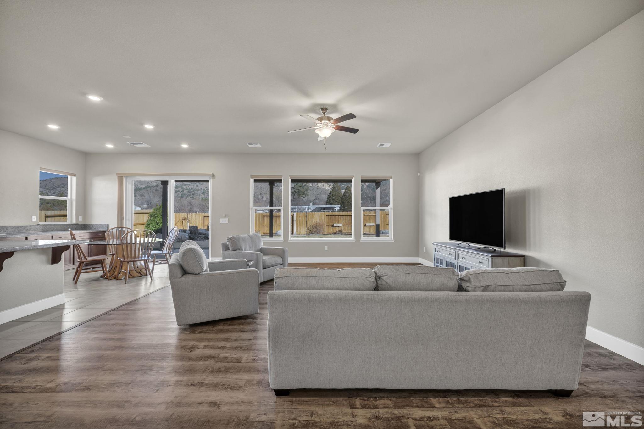 14264 Silver Moon Court Reno, NV 89521 - Photo 6 of 39 a living room with furniture and a flat screen tv