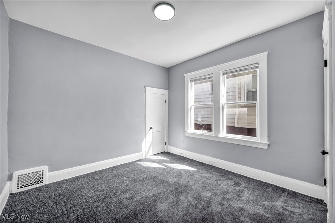 10112 Kinsman Road Cleveland, OH 44104 - Photo 20 of 49 Carpeted empty room featuring baseboards