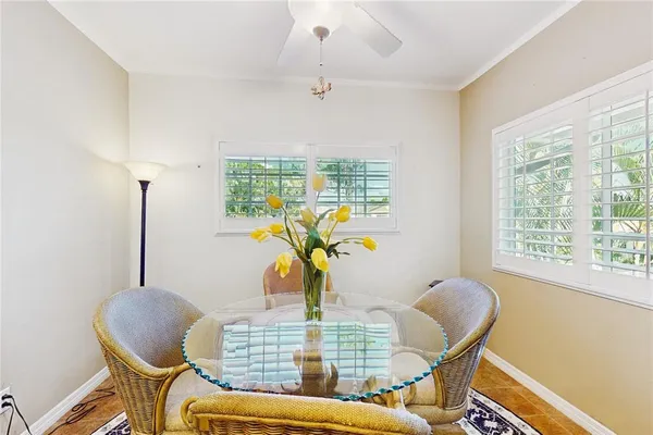 a view of a dining room with furniture window and outside view