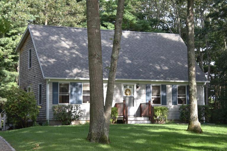 46 Deer Ridge Road Mashpee, MA 02649 - Photo 1 of 33 front view of house with a yard and an trees