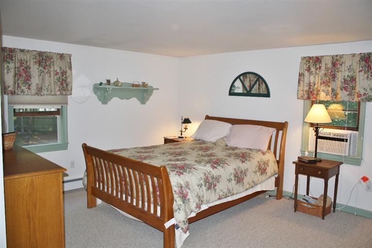 46 Deer Ridge Road Mashpee, MA 02649 - Photo 15 of 33 a bedroom with a bed and dresser