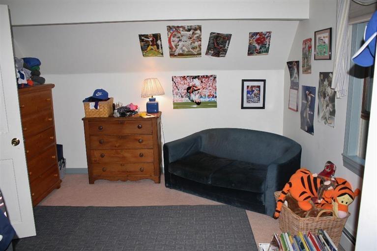 46 Deer Ridge Road Mashpee, MA 02649 - Photo 19 of 33 a living room with furniture and baby bed