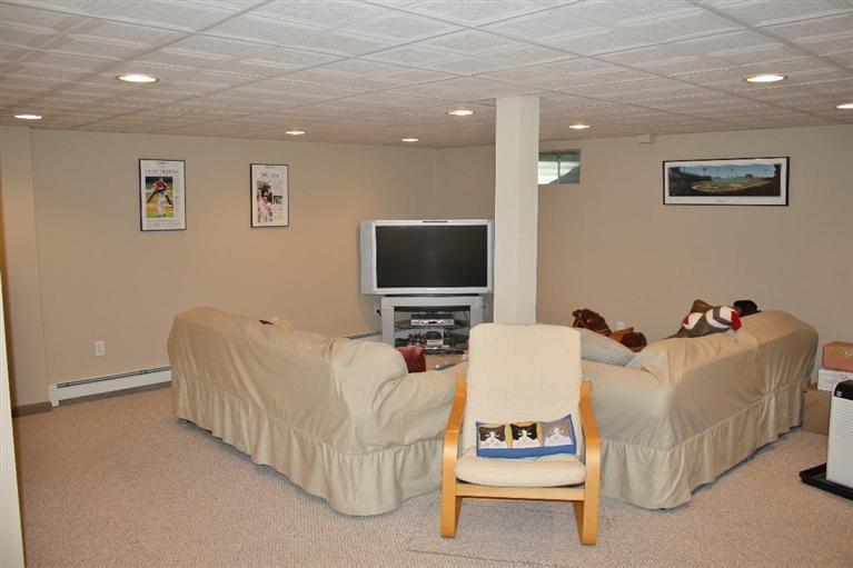 46 Deer Ridge Road Mashpee, MA 02649 - Photo 23 of 33 a living room with furniture and a flat screen tv