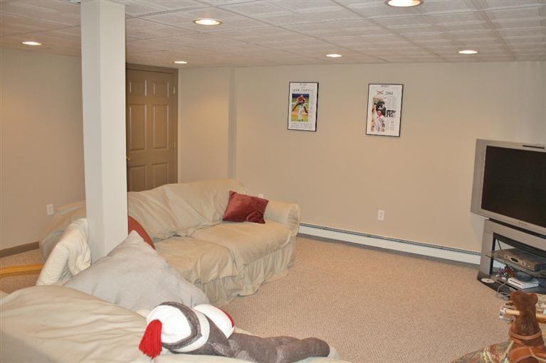 46 Deer Ridge Road Mashpee, MA 02649 - Photo 25 of 33 a living room with furniture and a flat screen tv