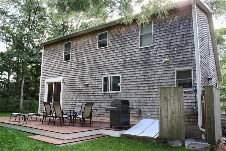 46 Deer Ridge Road Mashpee, MA 02649 - Photo 29 of 33 a backyard of a house with seating space