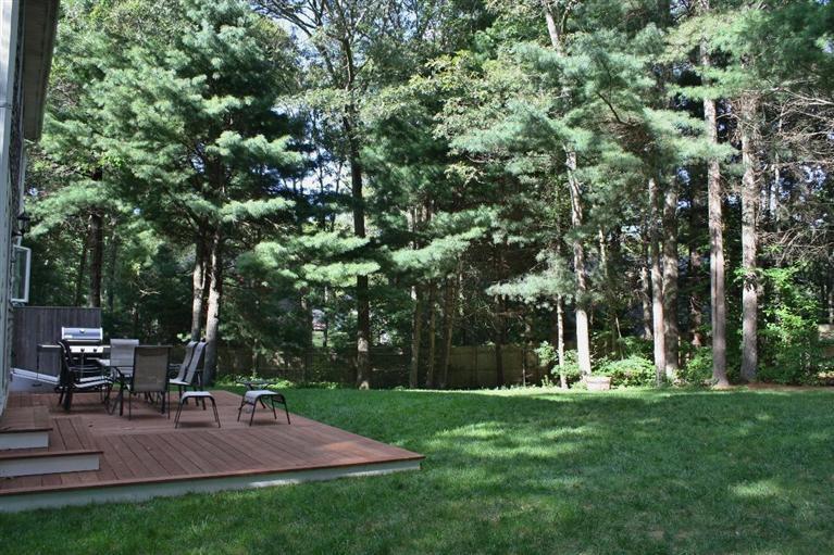 46 Deer Ridge Road Mashpee, MA 02649 - Photo 32 of 33 a view of a backyard with sitting area